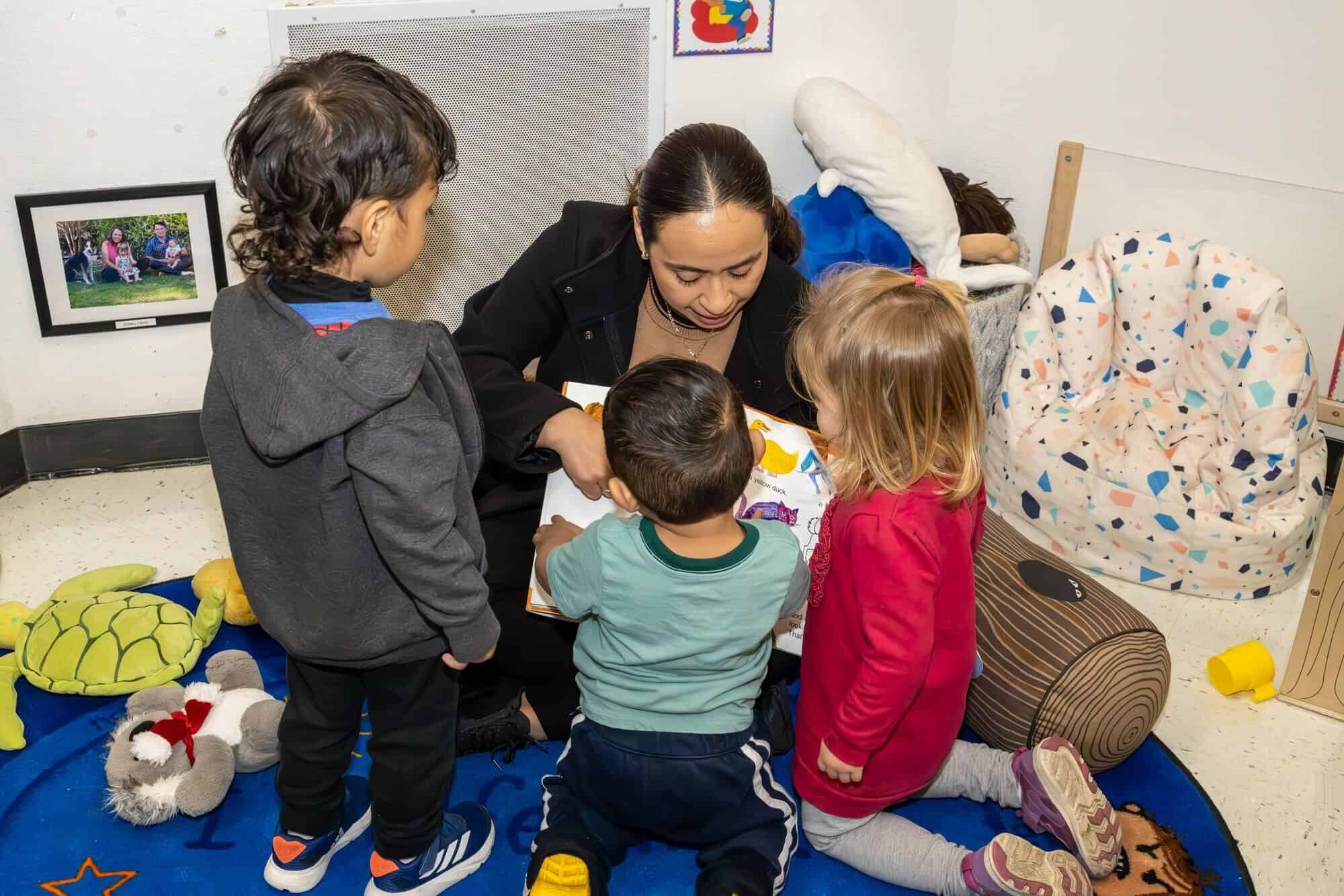 Teacher reading to children at RCCDP